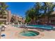 Community swimming pool and jacuzzi surrounded by lounge chairs and tables at 200 E Southern Ave # 173, Tempe, AZ 85282