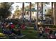 An exterior view of the community features a town square with shops and people relaxing at 20318 W Turney Ave, Buckeye, AZ 85396