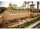 Welcoming entrance to Verrado Golf Club with manicured landscaping and a classic brick sign at 20318 W Turney Ave, Buckeye, AZ 85396