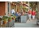 Inviting outdoor dining area with happy people enjoying food and each other along a sidewalk at 20318 W Turney Ave, Buckeye, AZ 85396