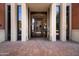 Close up of the entrance to Orchidhouse featuring a decorative glass door with a brick facade and tiled entryway at 21 E 6Th St # 412, Tempe, AZ 85281