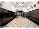 Grand lobby featuring high ceilings, black marble walls, and a tiled floor in a diamond pattern at 21 E 6Th St # 412, Tempe, AZ 85281