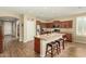 Open kitchen featuring a center island with bar seating and modern stainless steel appliances at 21362 N 260Th Ln, Buckeye, AZ 85396