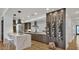 Modern kitchen features a breakfast bar, stylish pendant lighting, and a wine rack wall at 2336 N 12Th St, Phoenix, AZ 85006