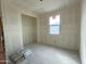 Unfinished bedroom with a window and closet space, ready for personalization at 2401 E Spur Dr, San Tan Valley, AZ 85140