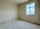 Unfinished bedroom featuring a window, awaiting final finishes and personalization at 2401 E Spur Dr, San Tan Valley, AZ 85140