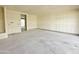 Unfinished living room showing bare walls and concrete floor, ready to be built into your dream space at 2401 E Spur Dr, San Tan Valley, AZ 85140