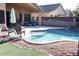 Beautiful backyard showcasing a pristine pool, ample seating, and well-maintained landscaping at 2509 E Paraiso Dr, Phoenix, AZ 85024