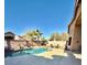 Spacious backyard featuring a swimming pool, patio area, privacy fence, and lush landscaping for privacy at 2509 E Paraiso Dr, Phoenix, AZ 85024