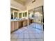 Large bathroom with double vanity and decorative tile floor at 2509 E Paraiso Dr, Phoenix, AZ 85024