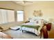 Bright bedroom with a queen sized bed, natural light, and neutral decor at 2509 E Paraiso Dr, Phoenix, AZ 85024