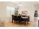 Bright dining room featuring a wood table, seating for six, and natural light from the window at 2509 E Paraiso Dr, Phoenix, AZ 85024