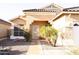 Charming single-story home with desert landscaping, a tiled roof, and a welcoming front entrance at 2509 E Paraiso Dr, Phoenix, AZ 85024