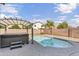 Beautiful backyard boasts a refreshing pool and a modern hot tub with a pergola for shade and relaxation at 2592 E Torrey Pines Ln, Chandler, AZ 85249