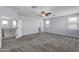 A bonus room with carpet and neutral walls, ceiling fan and views from the window at 2592 E Torrey Pines Ln, Chandler, AZ 85249