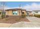 Cozy single-story home featuring a tiled roof and well-landscaped front yard at 25955 W Deer Valley Rd, Buckeye, AZ 85396