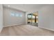 Bright bedroom featuring a sliding glass door and three windows with outdoor views at 26657 W Renee Dr, Buckeye, AZ 85396