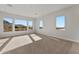 Bedroom with neutral carpet, recessed lighting, and views of the desert landscape at 26657 W Renee Dr, Buckeye, AZ 85396