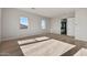 Bedroom featuring neutral carpet, recessed lights, and views of a home and desert at 26657 W Renee Dr, Buckeye, AZ 85396