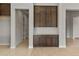 View of dark wood built-in cabinets with white countertop in a light, airy room at 26657 W Renee Dr, Buckeye, AZ 85396