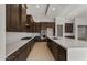 Modern kitchen with white countertop, stainless steel appliances, dark cabinetry and tile flooring at 26657 W Renee Dr, Buckeye, AZ 85396