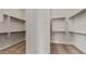 A walk-in closet featuring built-in shelving with metal hanging rods at 26657 W Renee Dr, Buckeye, AZ 85396