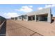 Backyard of a new construction home, showing a spacious yard ready for landscaping and outdoor enjoyment at 26817 W Renee Dr, Buckeye, AZ 85396