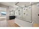 Modern bathroom with a glass-enclosed shower, elegant vanity, and sleek fixtures showcasing luxury design at 26817 W Renee Dr, Buckeye, AZ 85396