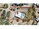 Aerial view of a house surrounded by desert landscape and a backyard pool at 28404 N 67Th St, Cave Creek, AZ 85331