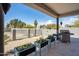 Cozy outdoor patio featuring desert landscaping, stainless steel grill, and a covered seating area at 28404 N 67Th St, Cave Creek, AZ 85331