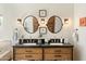 Bathroom vanity with double sinks, framed mirrors, and decorative accents at 28404 N 67Th St, Cave Creek, AZ 85331