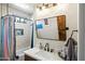 Bright bathroom featuring a white vanity, framed mirror, and bathtub with subway tile surround at 28404 N 67Th St, Cave Creek, AZ 85331