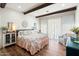 Bedroom featuring wood beam accents, cozy decor, and lots of natural light at 28404 N 67Th St, Cave Creek, AZ 85331