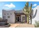 Charming desert home featuring a large Saguaro cactus, pergola, and paver walkway at 28404 N 67Th St, Cave Creek, AZ 85331