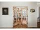 Hallway featuring decorative distressed wood doors and a glimpse into another room at 28404 N 67Th St, Cave Creek, AZ 85331