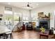 Cozy living room with a fireplace, ample natural light, and comfortable seating area at 28404 N 67Th St, Cave Creek, AZ 85331