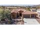 Beautiful aerial view of home with tile roof, desert landscaping, and three car garage at 30804 N 120Th Ave, Peoria, AZ 85383