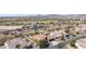 Aerial view of neighborhood with golf course and mountains in the distance at 30804 N 120Th Ave, Peoria, AZ 85383