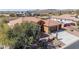 Beautiful aerial view of home with tile roof, desert landscaping, and three car garage at 30804 N 120Th Ave, Peoria, AZ 85383