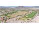 Overhead view showcasing a scenic golf course surrounded by desert landscape and upscale residences at 30804 N 120Th Ave, Peoria, AZ 85383