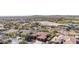 Aerial view of neighborhood with golf course in the distance at 30804 N 120Th Ave, Peoria, AZ 85383