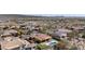 Expansive aerial view captures a desert community with homes featuring backyard pools and desert landscaping at 30804 N 120Th Ave, Peoria, AZ 85383