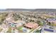 A high-angle view of a neighborhood showcasing beautiful homes, tile roofs, and desert landscaping in Arizona at 30804 N 120Th Ave, Peoria, AZ 85383