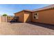 View of the backyard with rock and partial view of house at 30804 N 120Th Ave, Peoria, AZ 85383