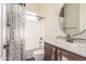 Bathroom with zebra shower curtain and a dark vanity at 30804 N 120Th Ave, Peoria, AZ 85383