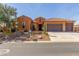 Inviting single-story home with desert landscaping, a three car garage, and brick accents at 30804 N 120Th Ave, Peoria, AZ 85383