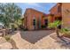 Close-up of beautifully landscaped front yard with stone driveway and desert flora at 30804 N 120Th Ave, Peoria, AZ 85383