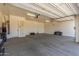 This is a large garage with a utility sink and cabinets at 30804 N 120Th Ave, Peoria, AZ 85383