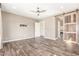 Large main bedroom with ceiling fan, barn door, and ensuite bathroom at 30804 N 120Th Ave, Peoria, AZ 85383