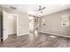 Spacious main bedroom featuring ceiling fan, ensuite bathroom, and natural light at 30804 N 120Th Ave, Peoria, AZ 85383